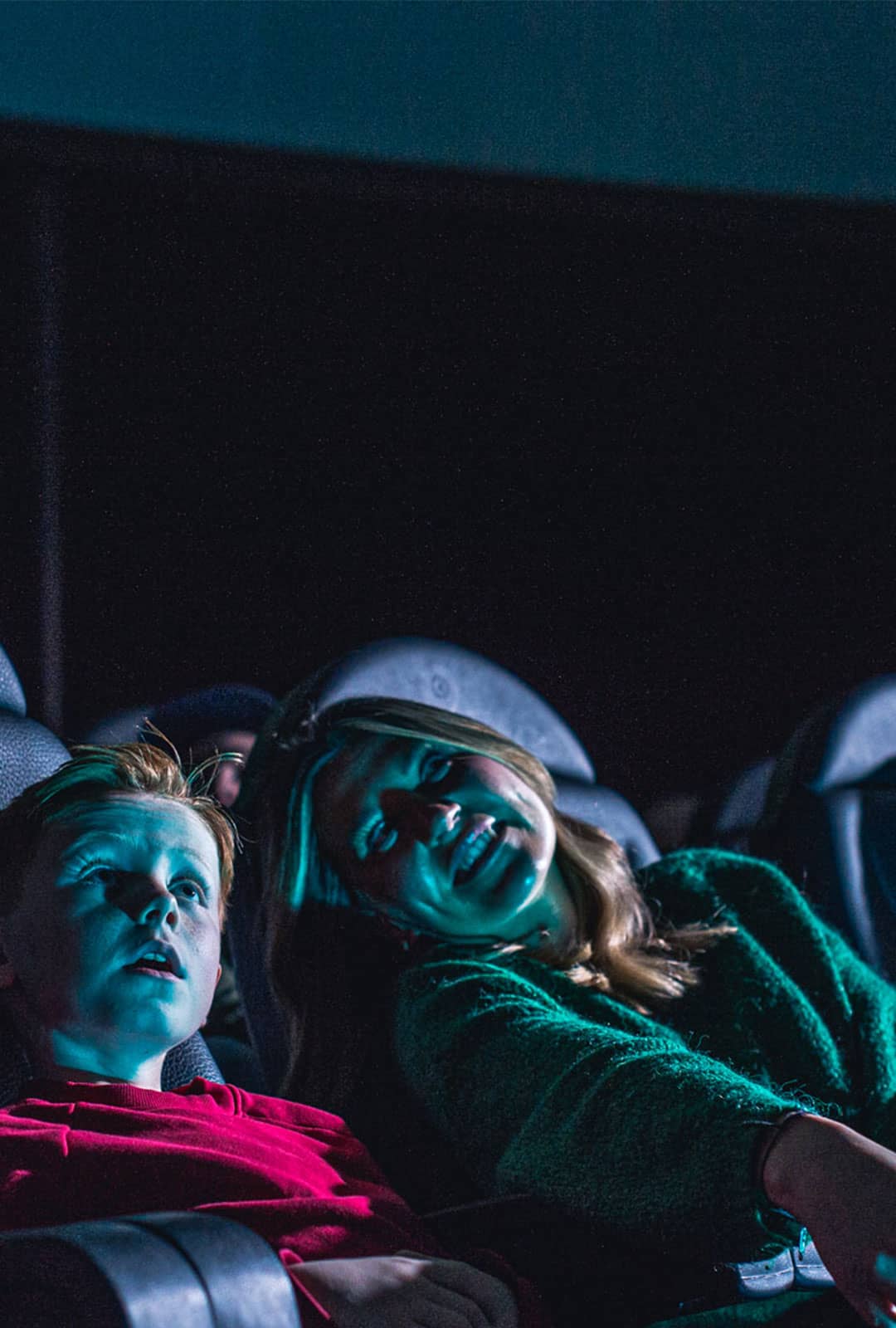 Mother and son in Life Science Centre Planetarium looking up to watch Little Bear show.