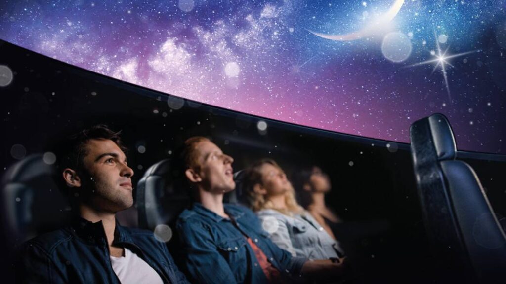 Adults sat in the science centre planetarium watching the Winter Skies show.