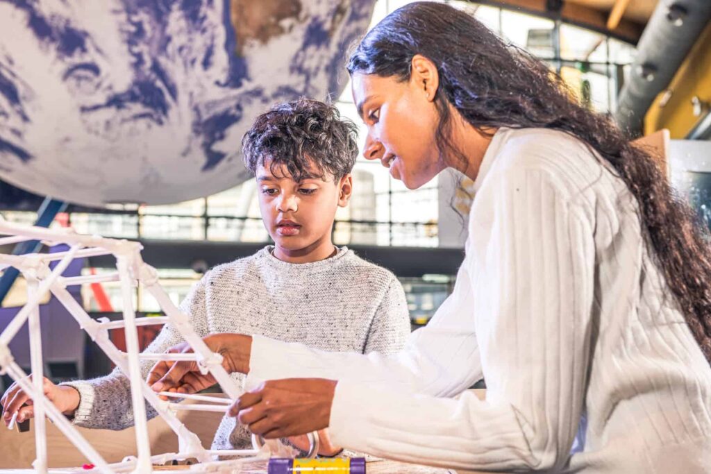 Mother and son completing a hands-on making activity at Life Science Centre.