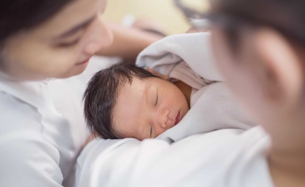Mother and new born, who have benefited from the pioneering work of the NHS Fertility Centre at The International Centre for Life.