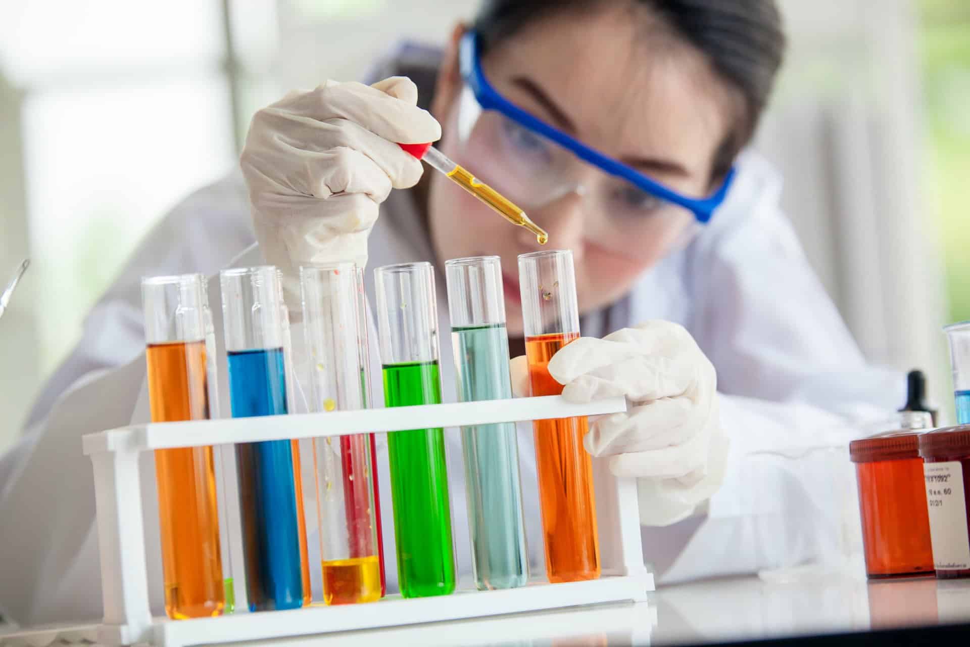 Research scientist using a pipette with brightly coloured liquids in a laboratory at The International Centre for Life.