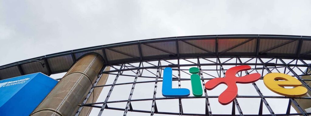 External photo of Life logo in front of Times Square