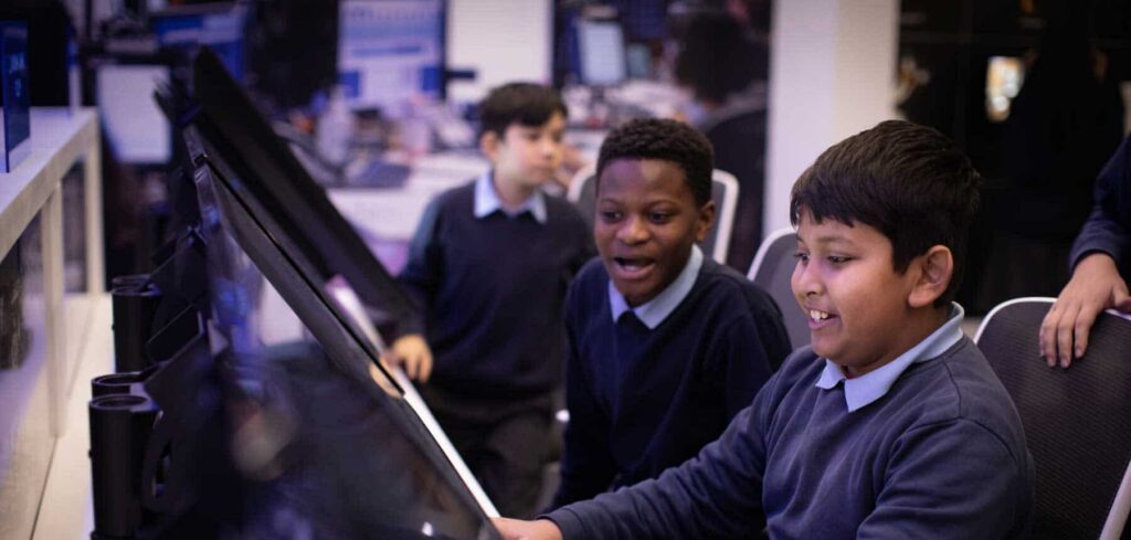 Students learning in Mission Control, a hands-on exhibit in Life Science Centre's Space Zone.