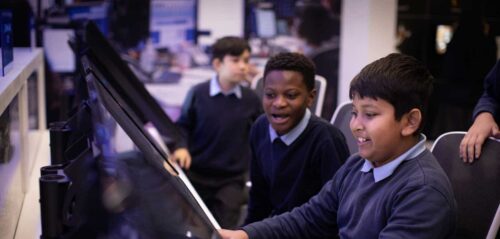 Students learning in Mission Control, a hands-on exhibit in Life Science Centre's Space Zone.