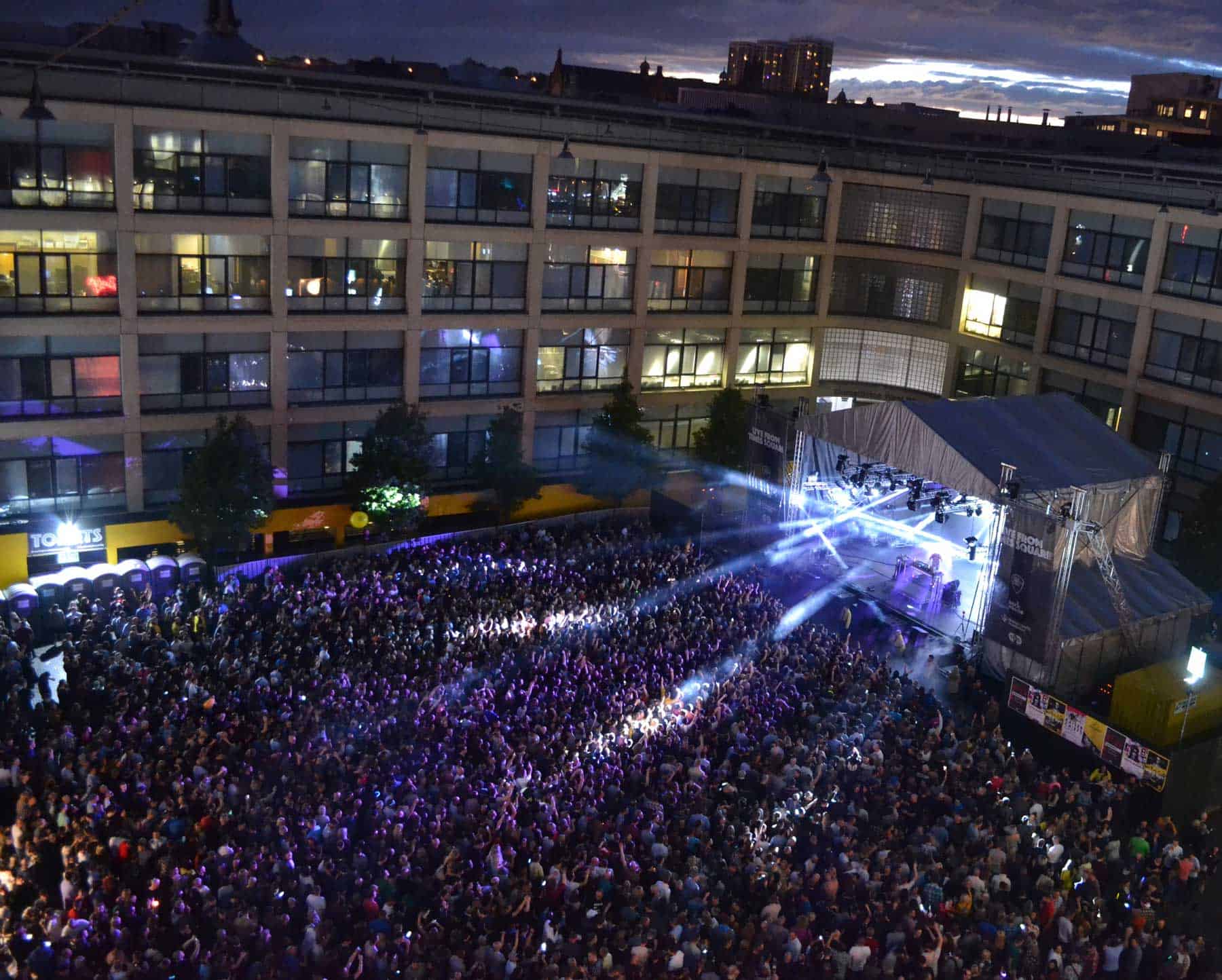 Times Square during a busy live music concert, part of The International Centre for Life