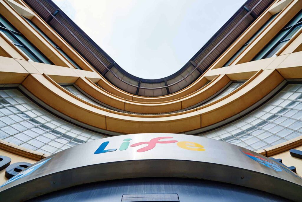 Exterior photo of The International Centre's for Life's Biomedical West entrance.