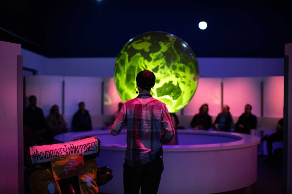 Group of visitors watching a live show in Space Zone.
