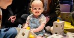 Small child playing with building blocks at Life Science Centre pre-school day.