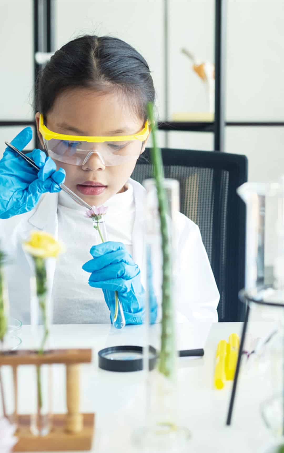Young school student working in a lab during a education workshop.