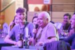 Speakeasy Attendee Asking A Question With Microphone.
