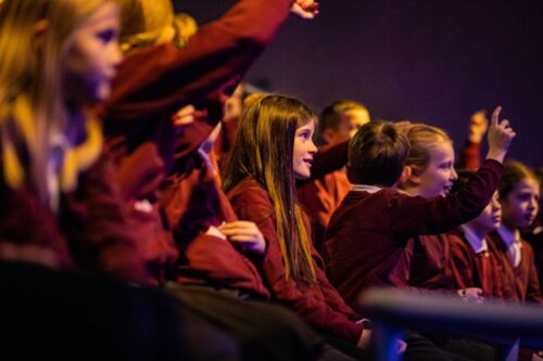 School children in Life Science Centre's theatre watching a live science show.