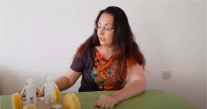 A Life explainer showing a science demo to students remotely.