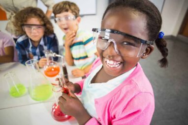 Young school students enjoying a hands-on experiment in Life's education labs..