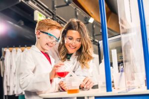Mother and son carrying out an experiment together in Life Science Centre.