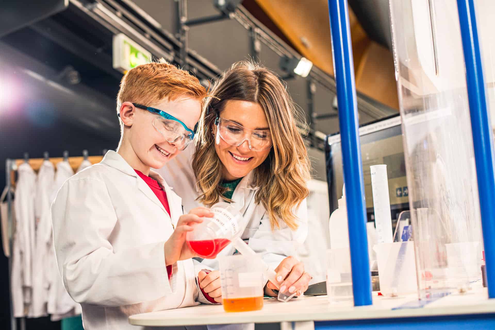 Mother and son carrying out an experiment together in Life Science Centre.