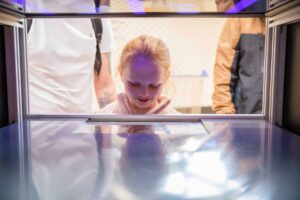 Girl Looking Into Exhibit In Brain Zone