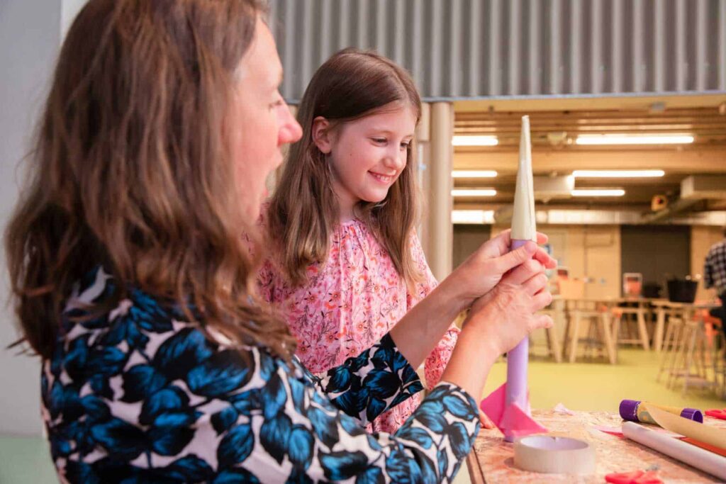 Young Child With Mother Completing A Hands On Activity In The Making Studios At Life Science Centre.
