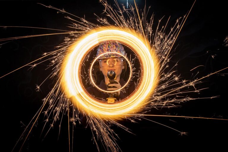 Life Science Centre Explainer Completing A Demonstration Using A Sparkler Attached To A Drill In The Live Science Theatre.