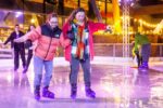 Mother and daughter family skating on Life Science Centre's Newcastle city centre outdoor ice rink