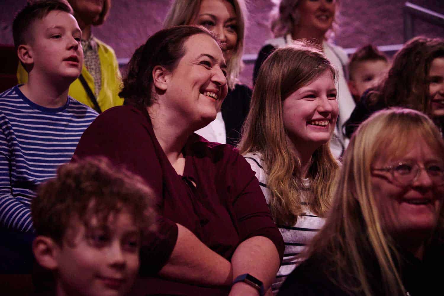 Mother and daughter watching a live science show in Life's theatre.