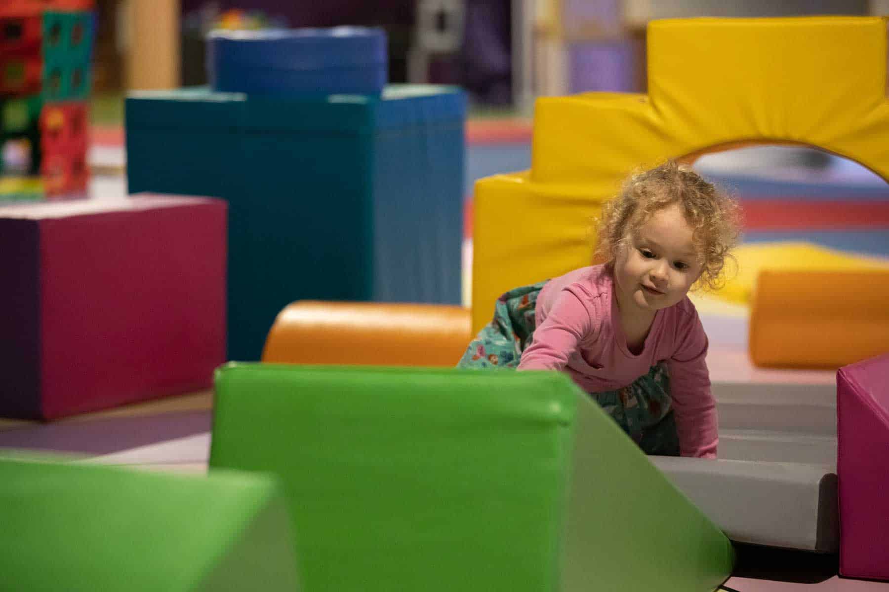 Toddler enjoying soft play inside Life Science Centre.