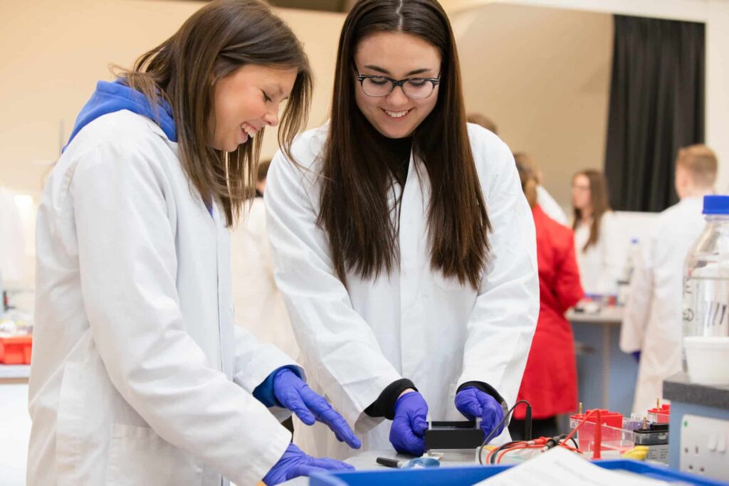 Two female students conducting hands-on PCR experiment in Life Science Centre workshop.