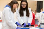 Two female students conducting hands-on PCR experiment in Life Science Centre workshop.