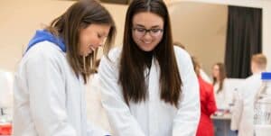 Two female students conducting hands-on PCR experiment in Life Science Centre workshop.