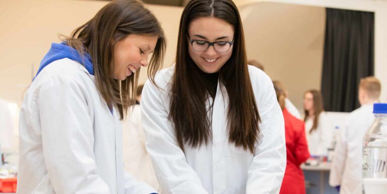 Two female students conducting hands-on PCR experiment in Life Science Centre workshop.