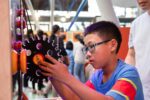Child Playing With Gears In Creativity Zone