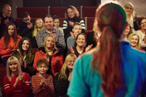 Audience clapping whilst watching an Explainer in Life's Science Theatre.