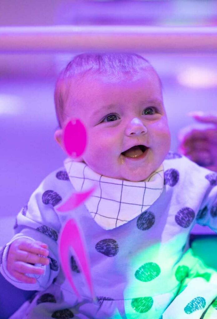 Baby Enjoying Sensory Play At Pre School Day