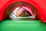 Little girl enjoying soft play at Life Science Centre pre-school day.