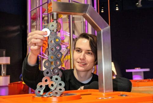 Adult male experimenting with magnets in Life's Wow Zone.