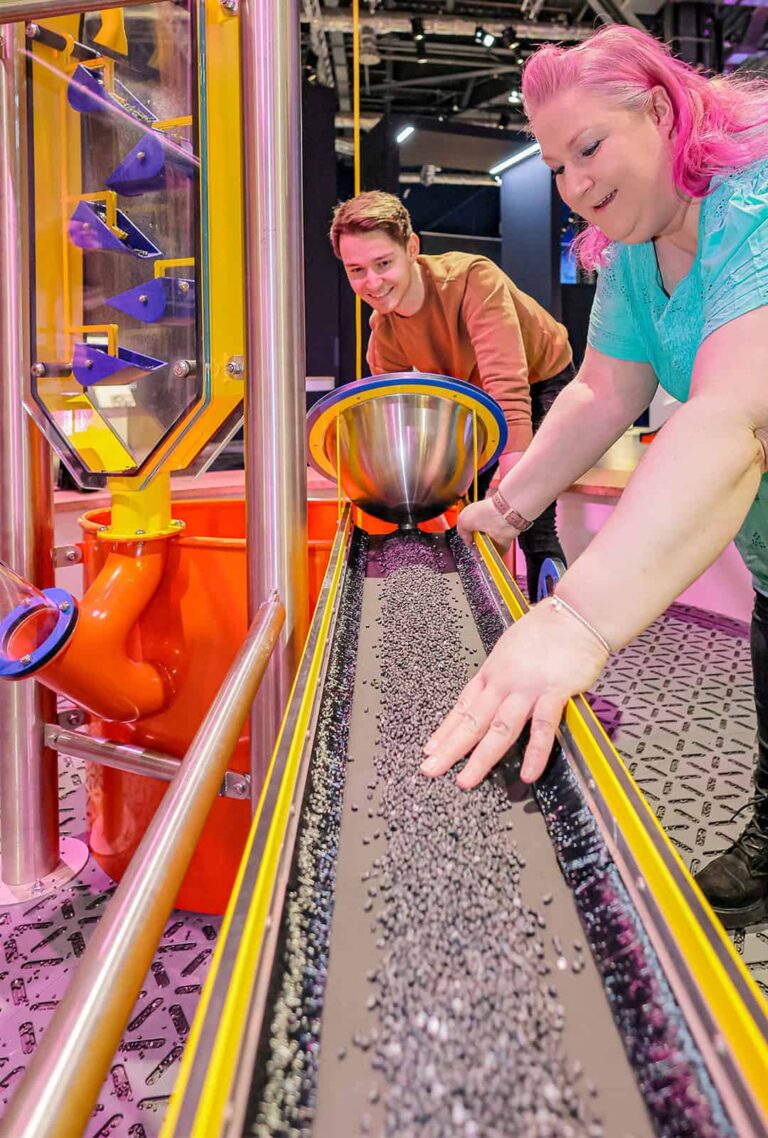 Adults operating Big Machine in Life's Wow Zone.