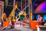 Family Playing in Life science centre Wow Zone, having hands on fun with the big machine.