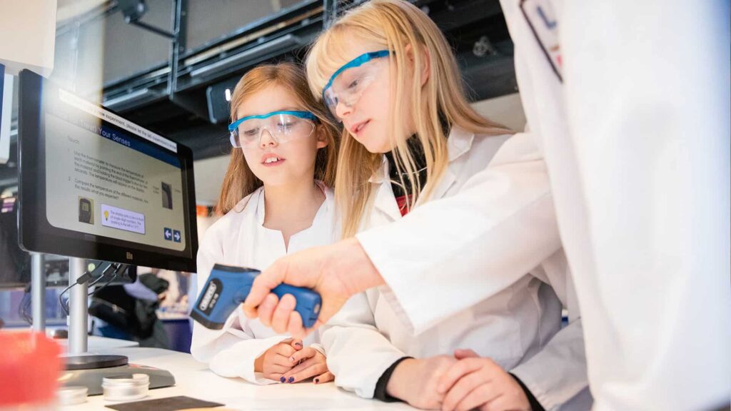 Family of three annual members using heat detector in Life Science Centre's Experiment Zone.