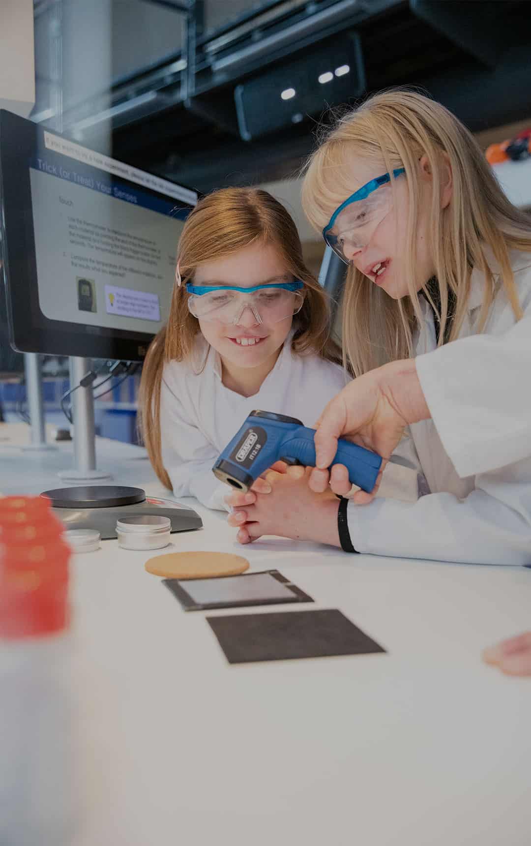 Family of three annual members using heat detector in Life Science Centre's Experiment Zone.