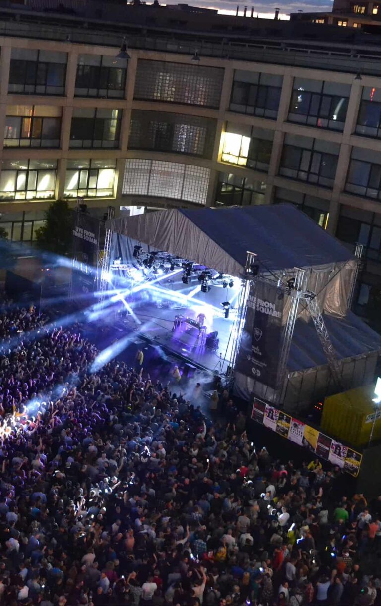 Times Square during a busy live music concert, part of The International Centre for Life