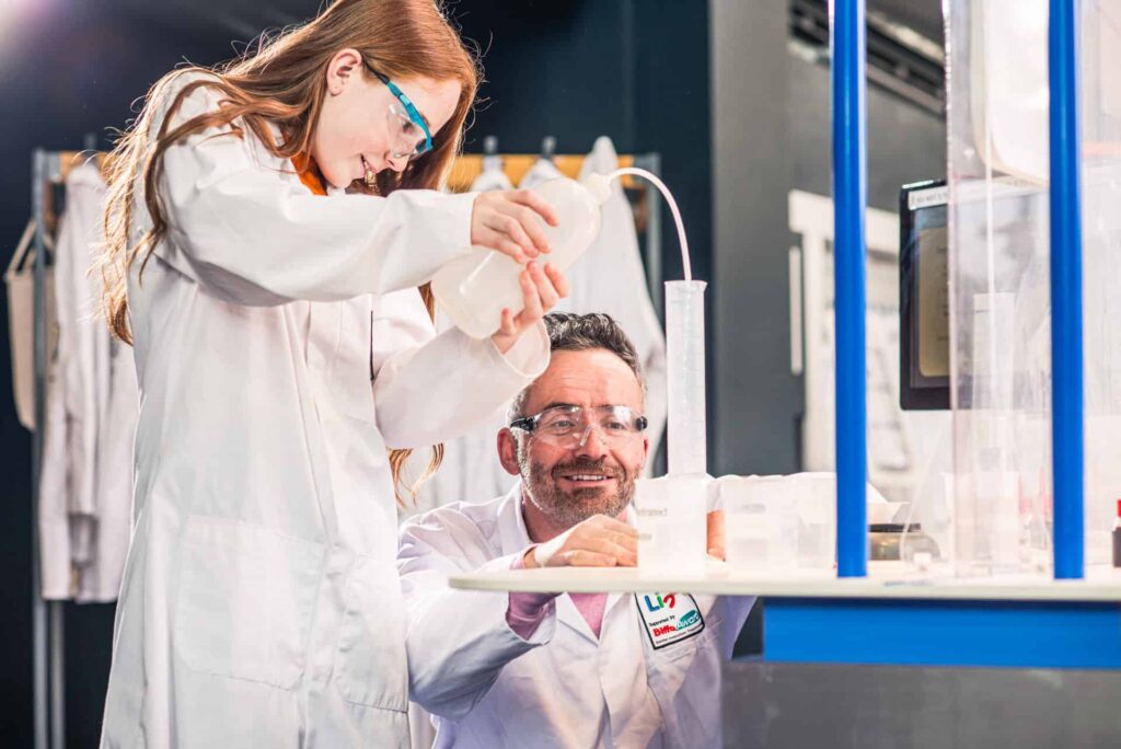 Father and daughter carrying out an experiment together in Life Science Centre.