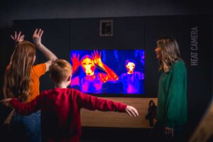 Family playing with heat camera