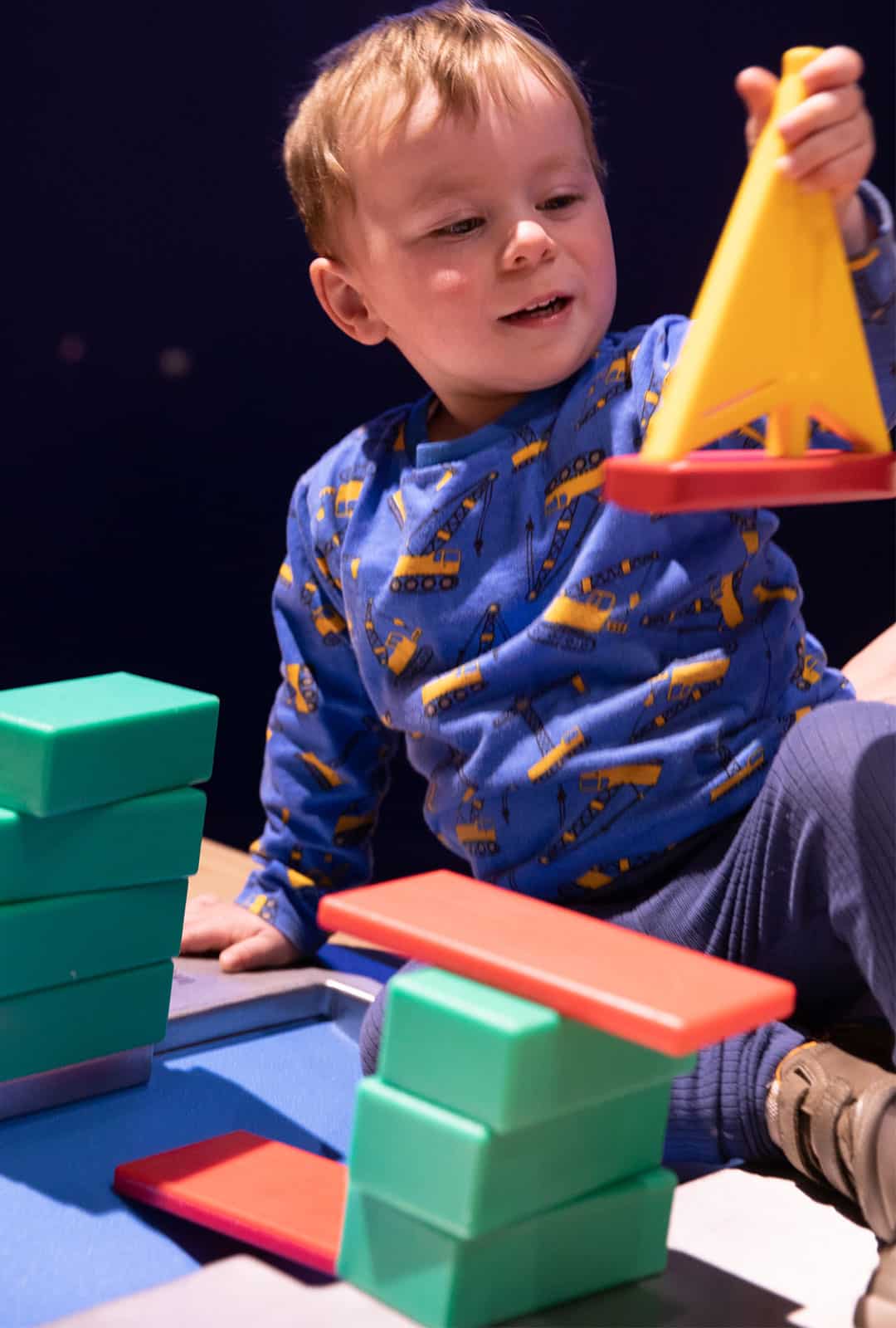 Little-boy-playing-with-building-blocks-at-Life-Science-Centre-Pre-School-Day.