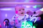 Baby-enjoying-sensory-play-at-pre-school-day
