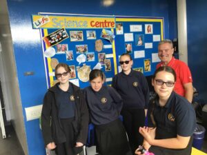 David Jones, Life's Community Liaison Manager with a group of school students who had created a display of their recent visit to the science centre.
