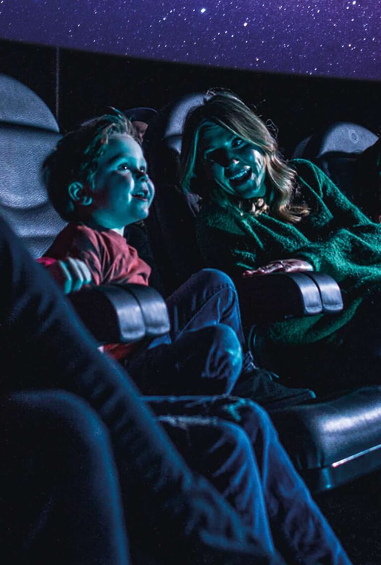 Mother and son in Just Look Up Planetarium Show at Life Science Centre.
