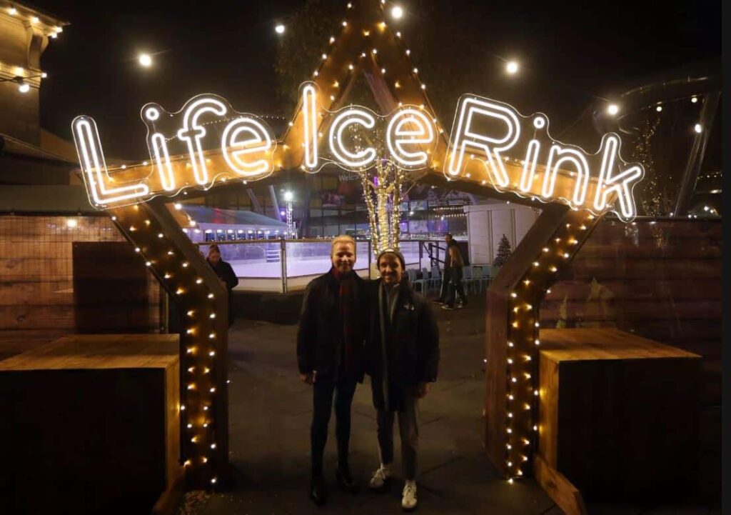 Couple stood at the ice rink star entrance in Newcastle.