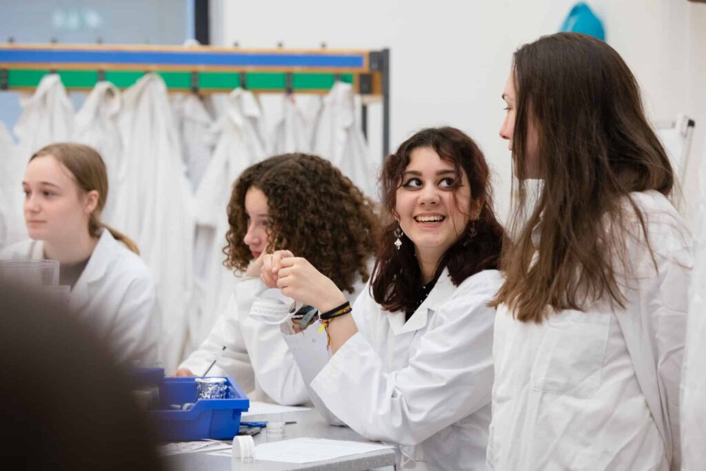 Three female sixth form students in a Life Science Centre biology workshop.