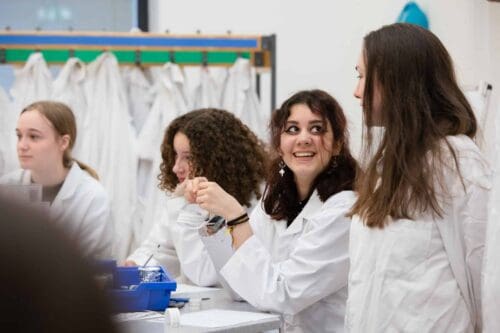 Three female sixth form students in a Life Science Centre biology workshop.
