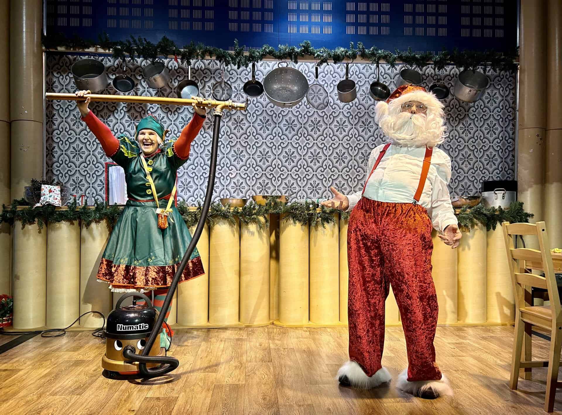 Santa and Twinkle the Elf during live science demonstration with hoover.