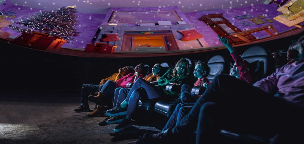 Family enjoying a festive planetarium show in Life Science Centre.